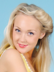 Golden-Haired pinup model playfully removes her petticoat and underware