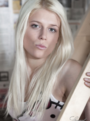 Platinum golden-haired model Lovely Cat displays her smiley face in her underclothing