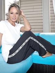 Dilettante honey Nikki Sims pulls out her large wobblers and takes off track panties