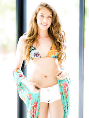 Slender white hotty with lengthy hair takes off her shorts and bikini to pose stripped