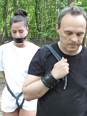 Juvenile dark brown serf is tutored and screwed in the forest by her Slaver