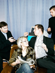 Lusty hottie in glasses receives her face glazed with cum after foursome groupsex