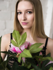 Petite titted Alisa Bonet positions undressed in dark nylons to flaunt her diminutive arse