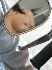 My hot babe showing off some skin on my Harley