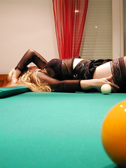 A slutty swinger wife having adult fun on a pool tale with sex toys