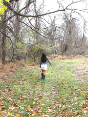 Dilettante model undresses to her underclothes during the time that climbing a scrubby tree