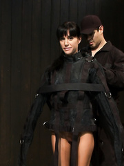 Darksome haired female Gia DiMarco is ensconced in a straitjacket and tortured