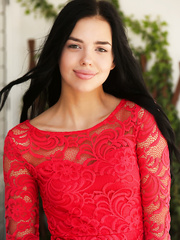 Russian teenager Venice Lei crosses her nude legs whilst posing bare