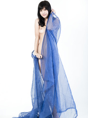 Bare Zelda kneels on sheer drapery to nude her gazoo in a hot closeup