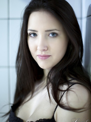 Solo beauty Patricia Sun piles her lengthy hair on her head in dark nylons merely