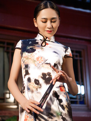 Dark Brown Oriental gal Wu Muxi undresses short costume to model precious arse & mambos bare