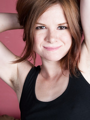 Cute redhead Zia drops her jeans and stretches wide open to show a ginger pussy