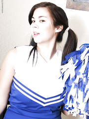 Pigtailed Oriental cheerleader Mai Ly flashing nice-looking upskirt underclothes