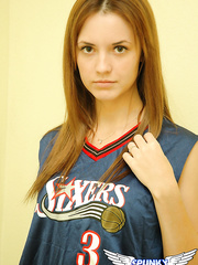 Youthful cheerleader Amy lifts her uniform to tease with hot pants & underboob