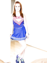 Cute redhead cheerleader Jessie Parker happily widening her constricted a-hole