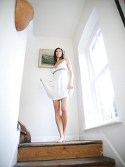 Black haired female Maria Eriksson sets her fine bazookas free from her white suit