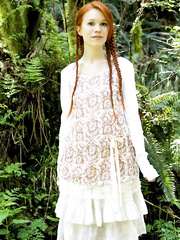 Natural redhead shows off her thin body out in the forest