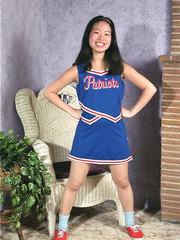 Oriental dilettante Ivy shedding cheerleader uniform for bushy cookie exposure