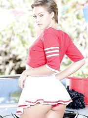 Dyke looking cheerleader Bailey Bae bares her petite legal age teenager breasts outside