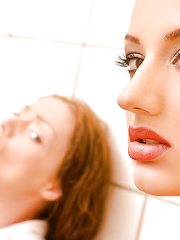 Redheads Aylin Diamond and Sophie Lynx engage in S&M sex in washroom