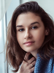 Delightful legal age teenager Anchen exposes her hawt body as this babe disrobes down on the ottoman