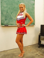Naughty cheerleader Jamey James stripping and exposing her naked feet