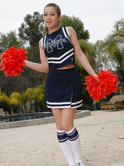 Legal Age Teenager cheerleader Dani Daniels pulls up her petticoat to toy her gloryhole