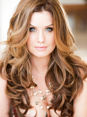 Sexy mommy Carrie Stevens posing seductively in hawt underware,strapon stocking and heels