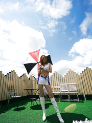 Fuckable oriental cheerleader lazily uncovering her tempting curves