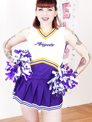 Tattooed schoolgirl cheerleader disrobes for hairless slit widening