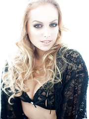 Centerfold whore Andrea is revealing her large mambos in underware