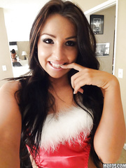Playful dark brown wench in Christmas outfit uncovering her hot body
