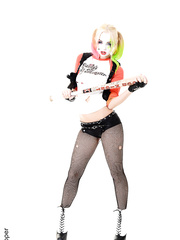 Solo beauty with a painted face disrobes nude after putting down her baseball bat