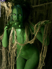 Female swamp creature emerges from the darksome with no garments on her undressed body