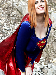 Thick redhead Alexsis Faye releases her massive mangos from Superman osutfit