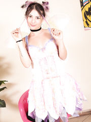 Dark Brown angel shows her pantyhose attired feet with her hair up in puff balls