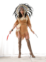 Older woman in Native American attire has her large bumpers and cum-hole caressed