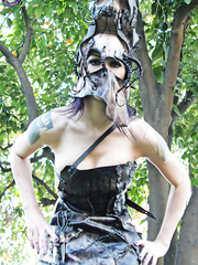 Tattooed female Kellie Laplegua receives completely nude below an old tree