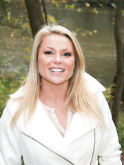 Dilettante playgirl pulls her jeans over her panty clad butt among the trees