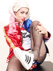 Solo model shows her pantyhose attired feet during the time that clothed as Harley Quinn