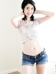 Hawt coed Ivy Aura peels off to show flat chest and masturbate her hairless cookie