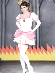 Smiley sweetheart in fancy cosplay outfit revealing her glamorous curves