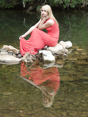 Hawt blond catches the sun outdoors and bares her admirable zeppelins on the patio
