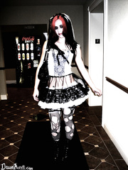 Goth hotty Dawn Avril hikes her petticoat to expose belt clad butt