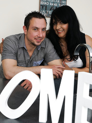 Corpulent dark brown woman seduces a stud over a cup of coffee and conversation