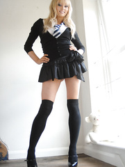 Sexy golden-haired schoolgirl Elle Parker sheds uniform posing topless in lace pants