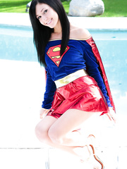 Brunette Hair cosplay angel Catie Minx disrobes Superman dress by the pool