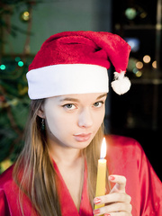 Slim legal age teenager in Christmas underware on knees showing shaved legal age teenager cunt