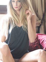 Seductive large tit blond sweetheart Rebecca Leah takes her costume and pants off