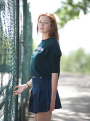 Hawt redhead Elen Moore flashes hawt upskirt walking to cheerleader practice